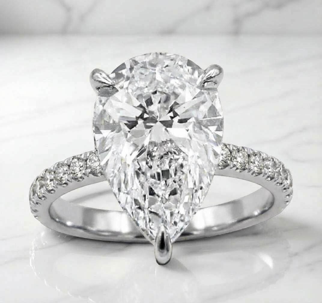 White gold pear lab diamond engagement ring with hidden halo