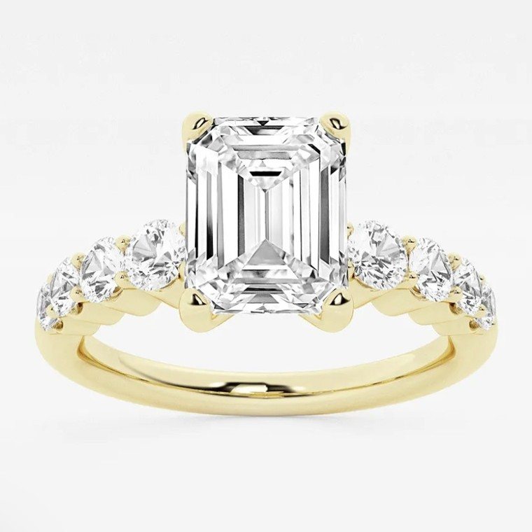 Emerald-cut diamond engagement ring in yellow gold