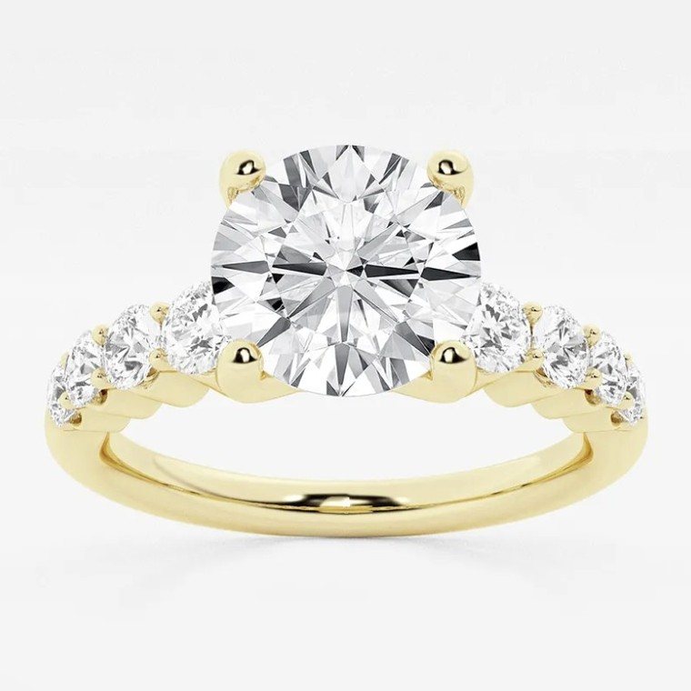 Round-cut diamond engagement ring in yellow gold