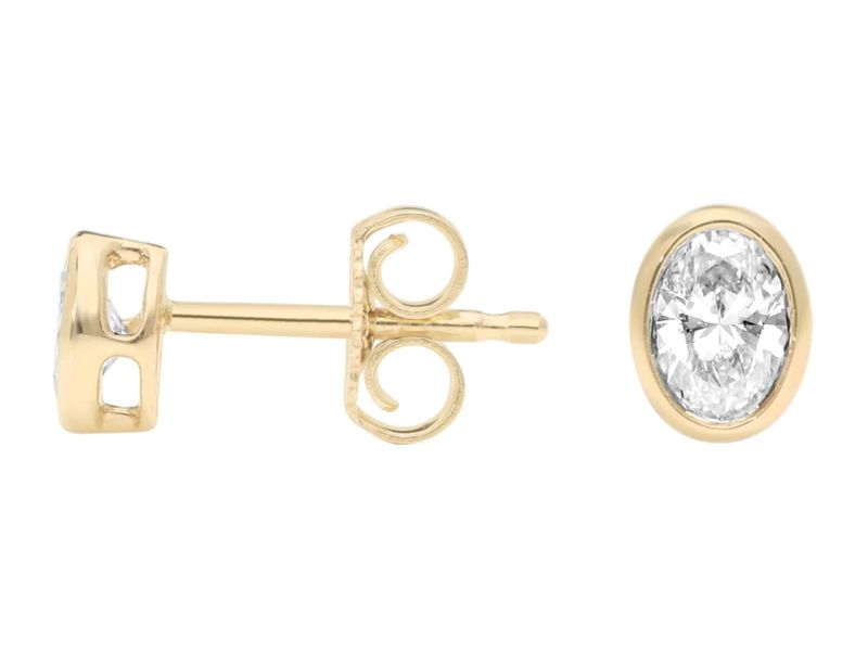Oval Bezel Studs in yellow gold, side view